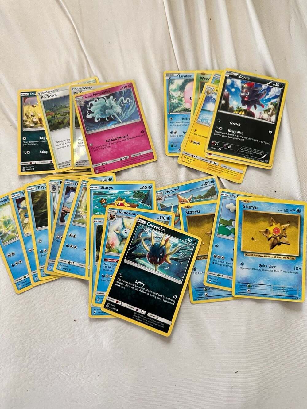 Assorted Lot of 24 Pokémon cards Alolan Ninetales, Zorua, and Vaporeon